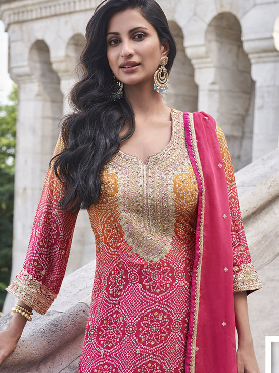 Silk Wedding Salwar Kameez
in Pink and Majenta with Zari work