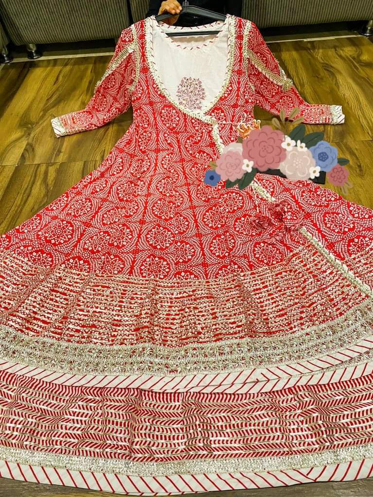 Premium heavy cotton long sleeveless gown detailed with work on yoke & heavy gota work paired with beautiful bandhani print long anrakha pattern long shrug detailed with gota lace & gota all over with tessels