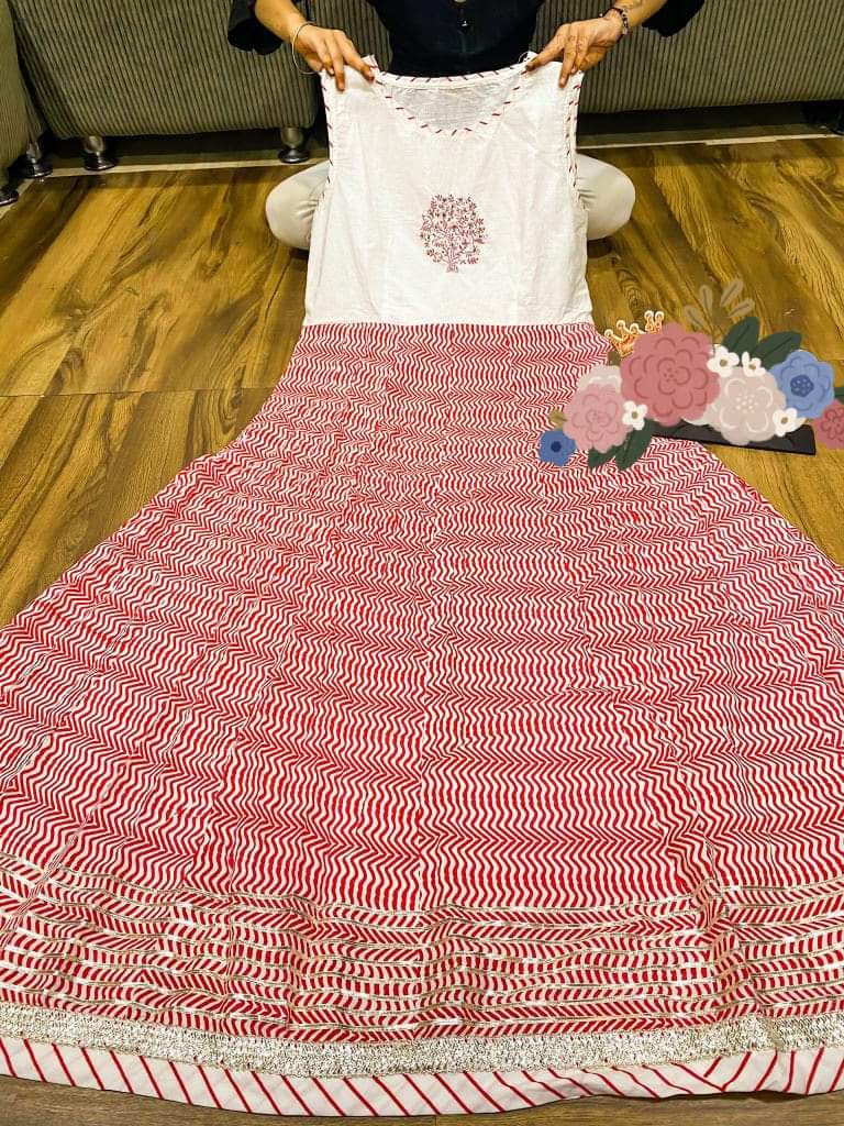 Premium heavy cotton long sleeveless gown detailed with work on yoke & heavy gota work paired with beautiful bandhani print long anrakha pattern long shrug detailed with gota lace & gota all over with tessels