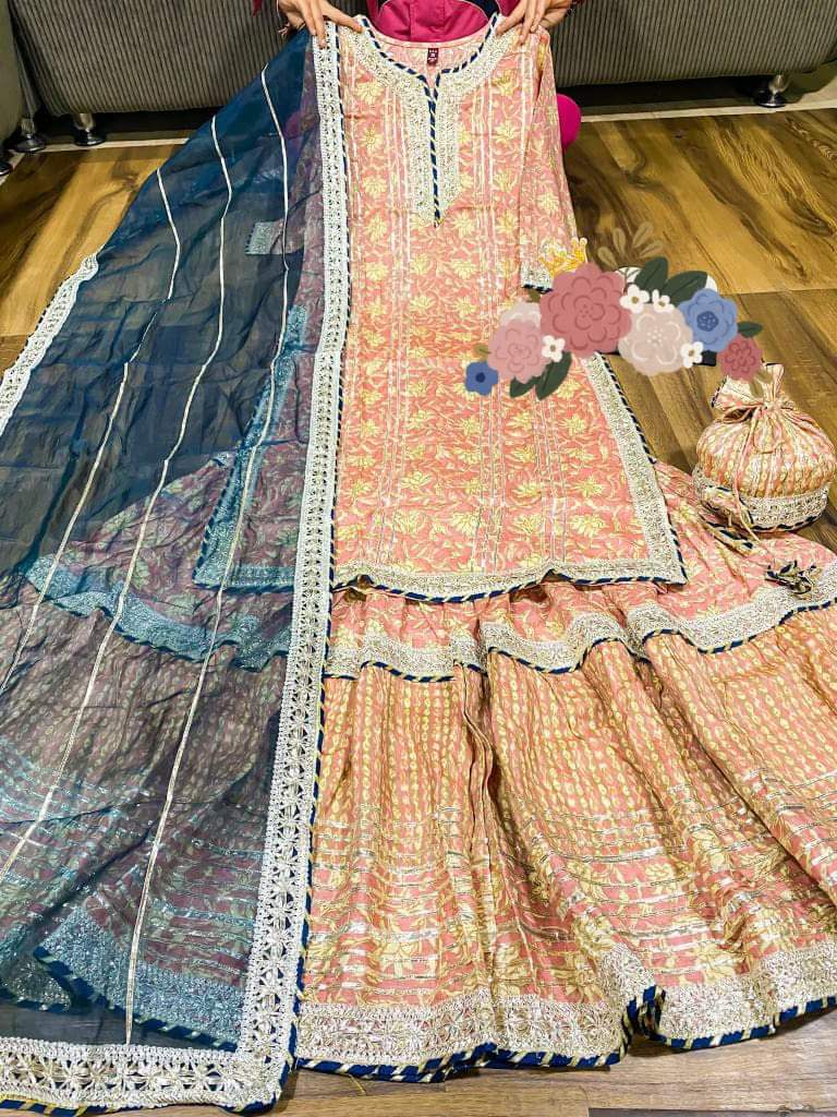 Premium cotton kurti with heavy gota detailing & lace on yoke Cotton dupatta with lace & cotton print flare sharara with heavy gota lace Complimentary bag (potli)