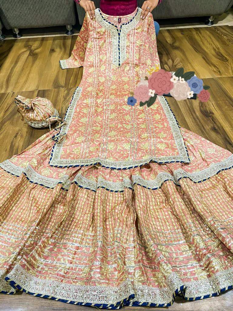 Premium cotton kurti with heavy gota detailing & lace on yoke Cotton dupatta with lace & cotton print flare sharara with heavy gota lace Complimentary bag (potli)