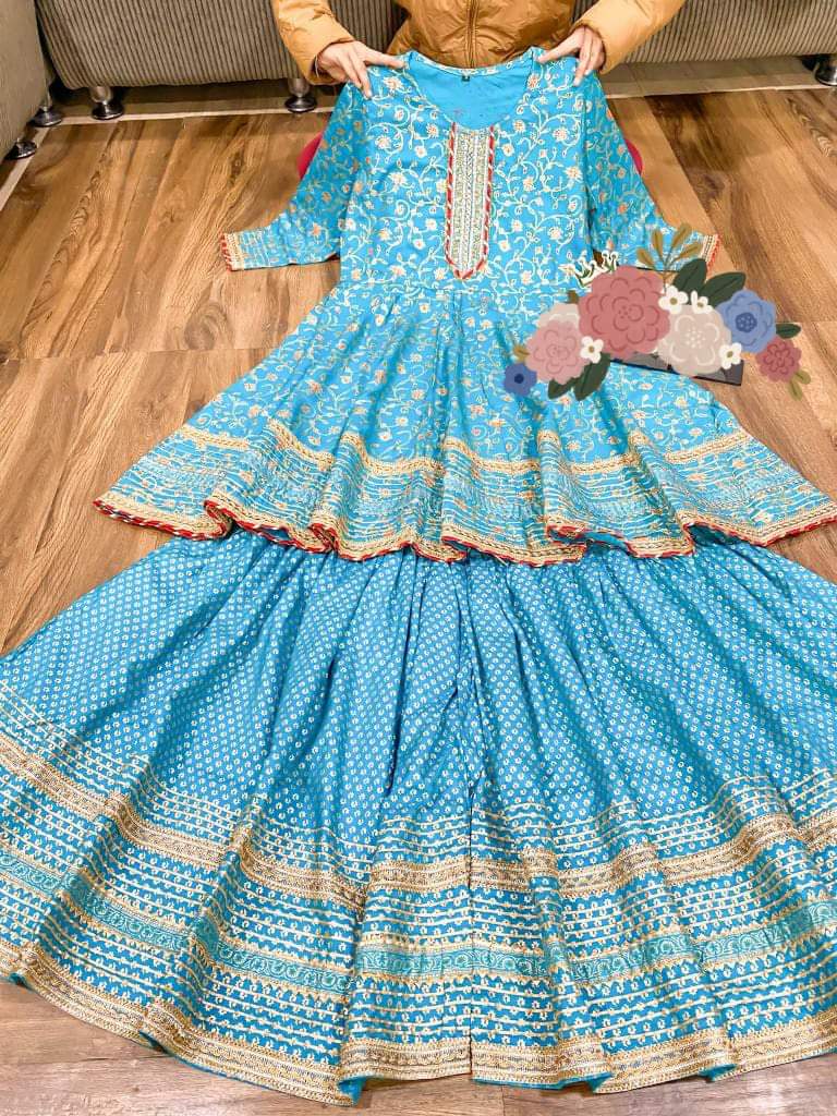 Premium cotton peplum & sharara detailed with gold liquid zari all over & hand work on yoke with heavy gota detailing all over paired with chiffon dupatta with gota detailing