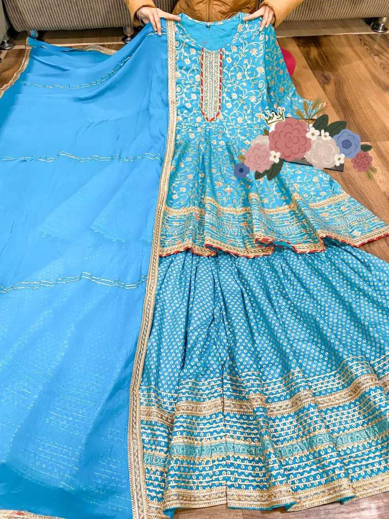 Premium cotton peplum & sharara detailed with gold liquid zari all over & hand work on yoke with heavy gota detailing all over paired with chiffon dupatta with gota detailing