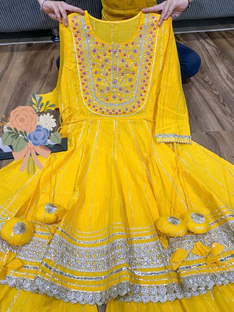 Premium cotton Lurex peplum detailed with beautiful zari embroidery & mirror work on yoke with heavy gota work & tassles . 💛❤️ Premium cotton Lurex sharara with heavy gota detailing 💛❤️ Premium chiffon dupatta with gota lace & gota flower