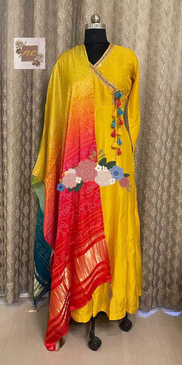 Gown* _Pure Russian silk stitched gown designed with beautiful handwork in Angrakha Style with sequins highlighter & colourful thread tassels_ *Dupatta* _Pure Gajji silk bandej duppata with beautiful colours & tissue border (lagdi patta) & tassels