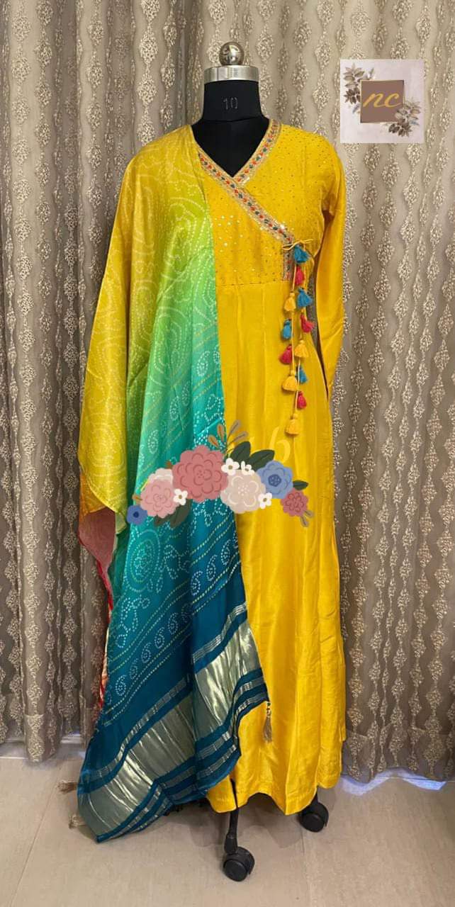 Gown* _Pure Russian silk stitched gown designed with beautiful handwork in Angrakha Style with sequins highlighter & colourful thread tassels_ *Dupatta* _Pure Gajji silk bandej duppata with beautiful colours & tissue border (lagdi patta) & tassels