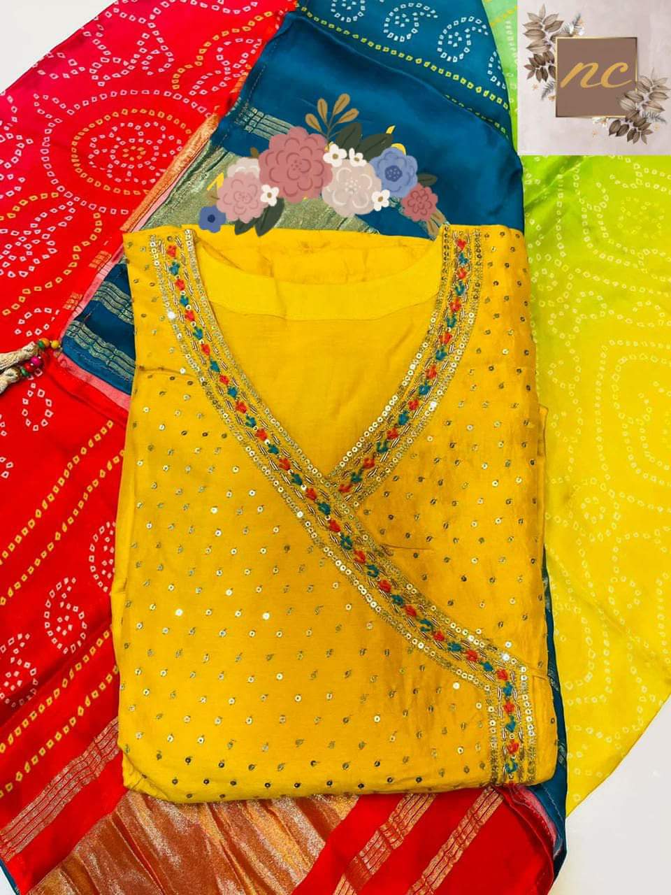 Gown* _Pure Russian silk stitched gown designed with beautiful handwork in Angrakha Style with sequins highlighter & colourful thread tassels_ *Dupatta* _Pure Gajji silk bandej duppata with beautiful colours & tissue border (lagdi patta) & tassels