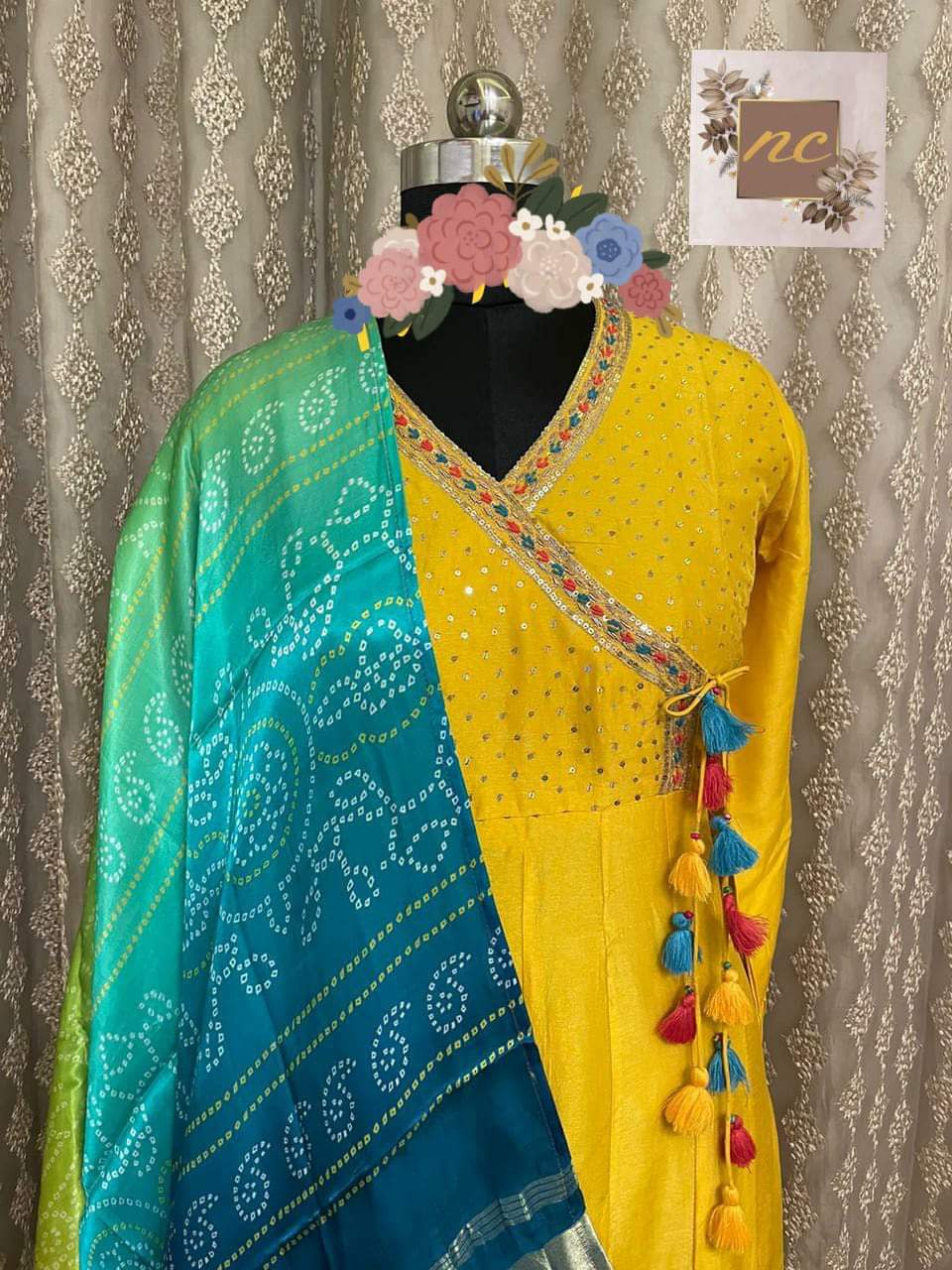 Gown* _Pure Russian silk stitched gown designed with beautiful handwork in Angrakha Style with sequins highlighter & colourful thread tassels_ *Dupatta* _Pure Gajji silk bandej duppata with beautiful colours & tissue border (lagdi patta) & tassels