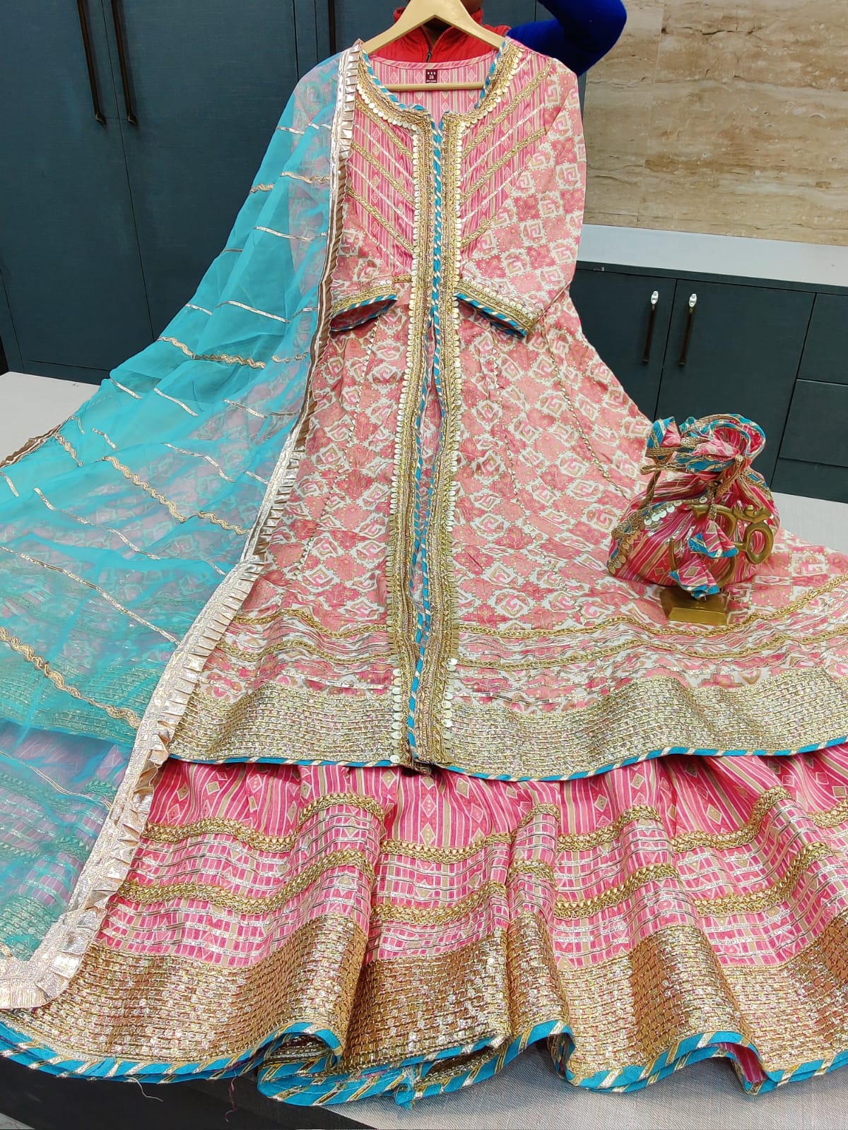 BEAUTIFUL SHARARA DRESS WITH COMPLIMENTARY POTLI* DESIGNER BEAUTIFUL LONG REYON KURTI WITH FRONT SLIT & GOTA DETAILING PAIRED WITH BEAUTIFUL SHARARA AND ORGANZA DUPATTA WITH GOTA DETAILING* COMPLIMENTARY POTLI WITH TASSELS & GOTA WORK