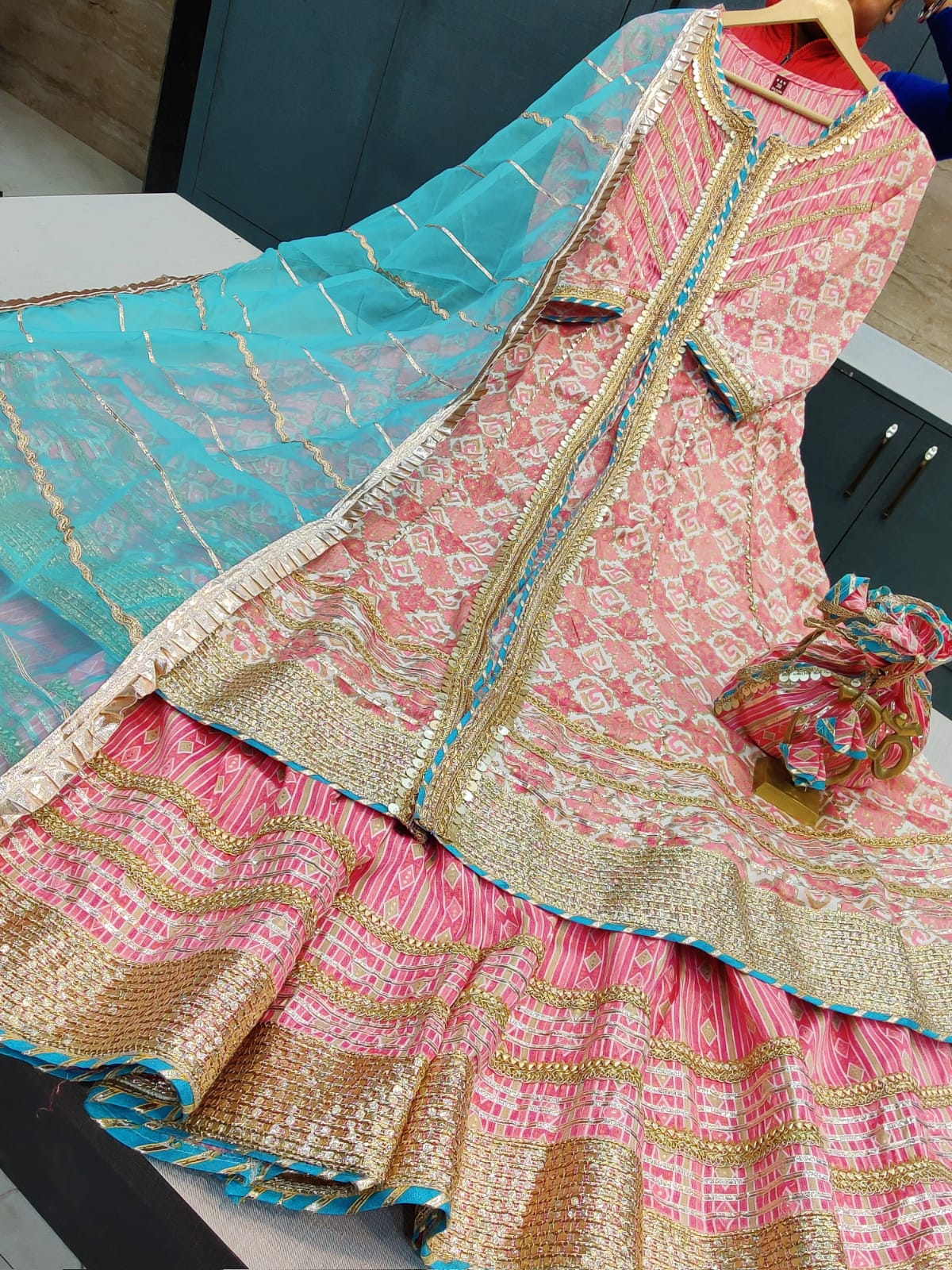 BEAUTIFUL SHARARA DRESS WITH COMPLIMENTARY POTLI* DESIGNER BEAUTIFUL LONG REYON KURTI WITH FRONT SLIT & GOTA DETAILING PAIRED WITH BEAUTIFUL SHARARA AND ORGANZA DUPATTA WITH GOTA DETAILING* COMPLIMENTARY POTLI WITH TASSELS & GOTA WORK