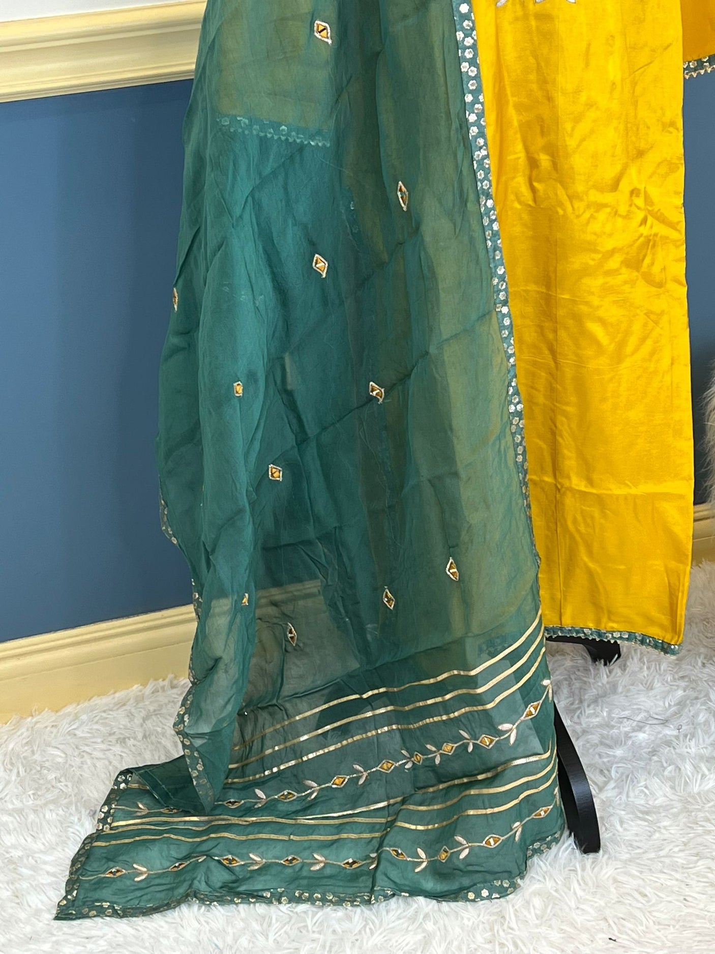 Pure russian silk with beautiful Patra mirror,gotta patti and resham embroidery on neck with tuscons ,gotta lace on ghera and sleeves, pure organza duppta with beautiful gotta patti and mirror handwork embroidery on duppta with print border