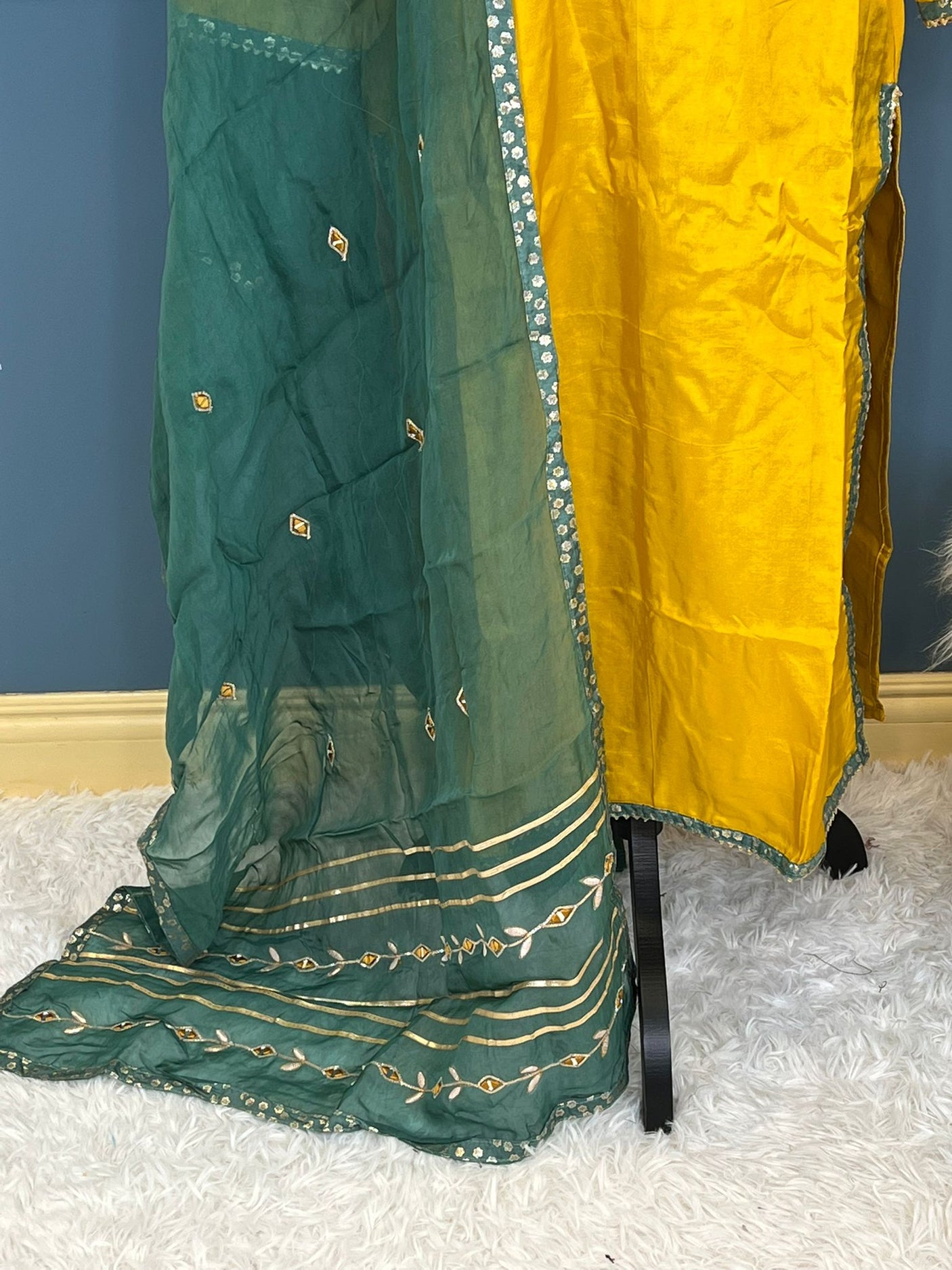 Pure russian silk with beautiful Patra mirror,gotta patti and resham embroidery on neck with tuscons ,gotta lace on ghera and sleeves, pure organza duppta with beautiful gotta patti and mirror handwork embroidery on duppta with print border