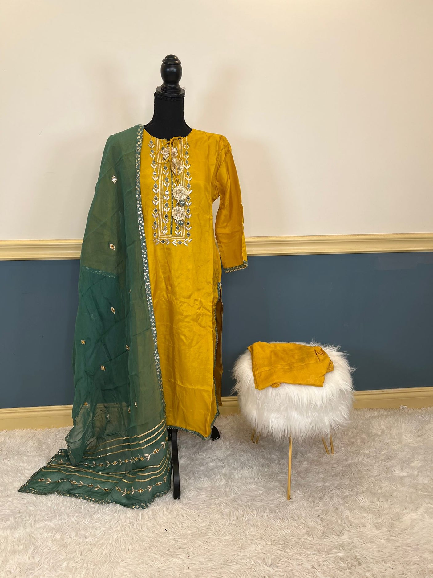 Pure russian silk with beautiful Patra mirror,gotta patti and resham embroidery on neck with tuscons ,gotta lace on ghera and sleeves, pure organza duppta with beautiful gotta patti and mirror handwork embroidery on duppta with print border
