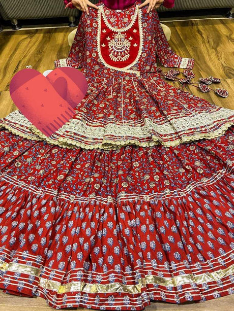 Premium cotton kalamkari print  peplum detailed with beautiful work  on yoke with heavy gota work & beautiful tassles . Premium cotton kalamkari & block print  skirt with heavy gota detailing.  Premium chiffon dupatta with gota lace & gota flower