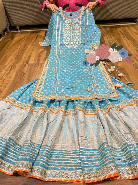 Premium cotton kurti with heavy gota detailing & lace on yoke  Kota silk  dupatta with  lace  & cotton print flare sharara with heavy gota lace   Complimentary bag ( potli)