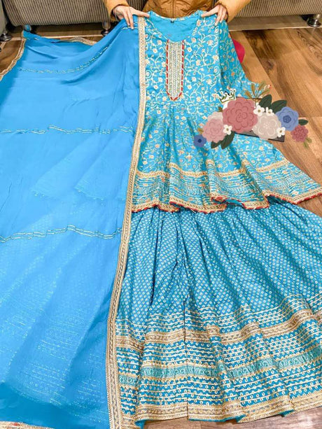 Premium cotton peplum & sharara detailed with gold liquid zari all over & hand work on yoke with heavy gota detailing all over paired with chiffon dupatta with gota detailing