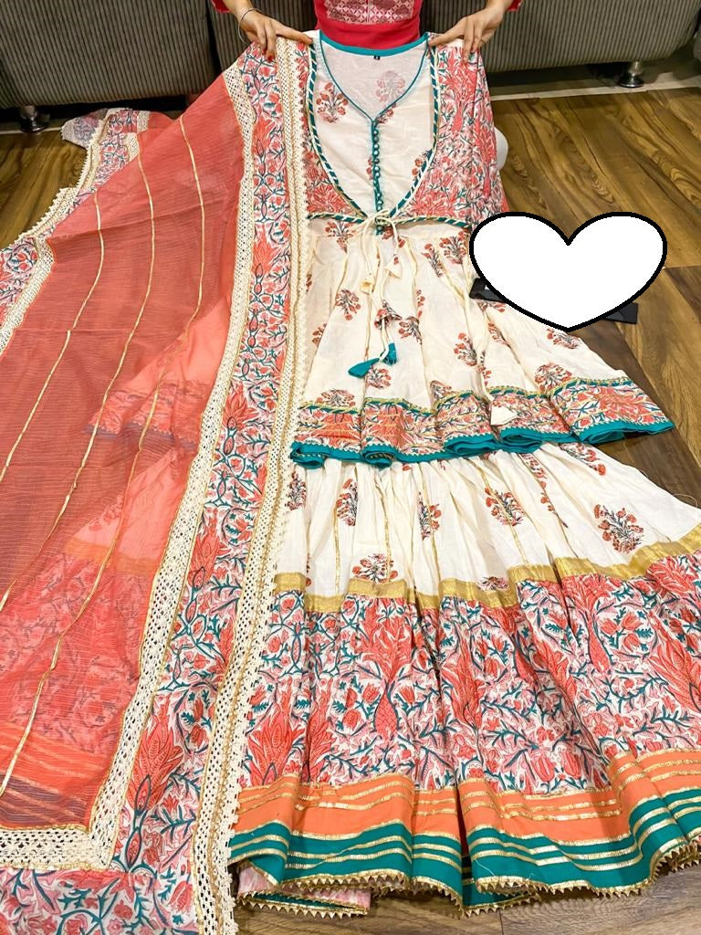 Premium cotton peplum with attached jacket detailed with pipe work , tassles & gota work.