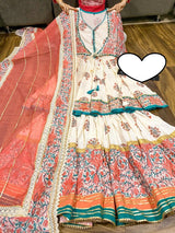 Premium cotton peplum with attached jacket detailed with pipe work , tassles & gota work.