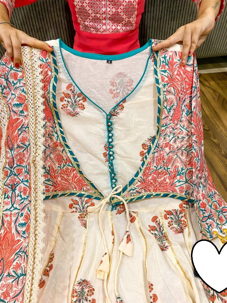 Premium cotton peplum with attached jacket detailed with pipe work , tassles & gota work.