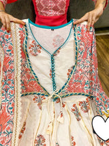 Premium cotton peplum with attached jacket detailed with pipe work , tassles & gota work.