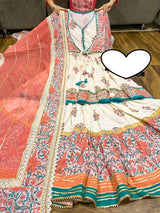 Premium cotton peplum with attached jacket detailed with pipe work , tassles & gota work.